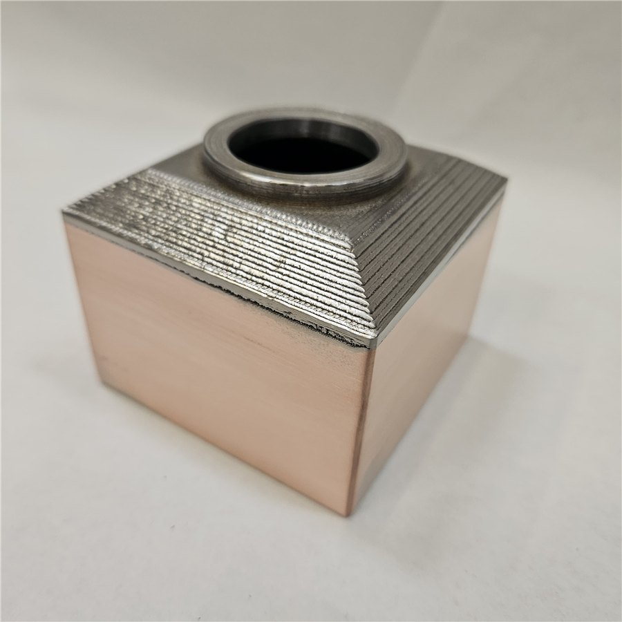 Finished multi-material copper and nickel-alloy component — a qualified, ready part